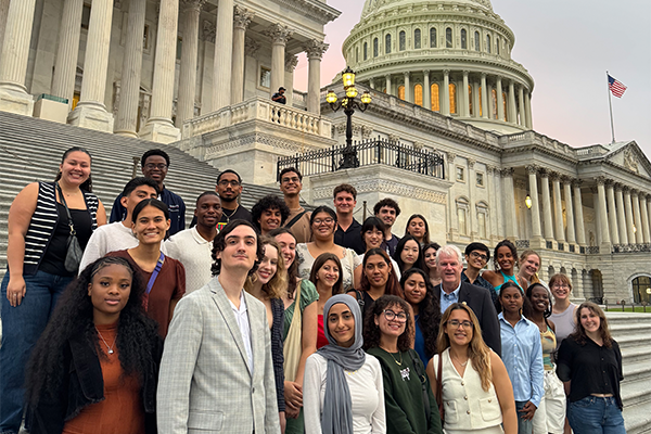 Summer Policy Academy students stand on the steps of the U.S. Capitol